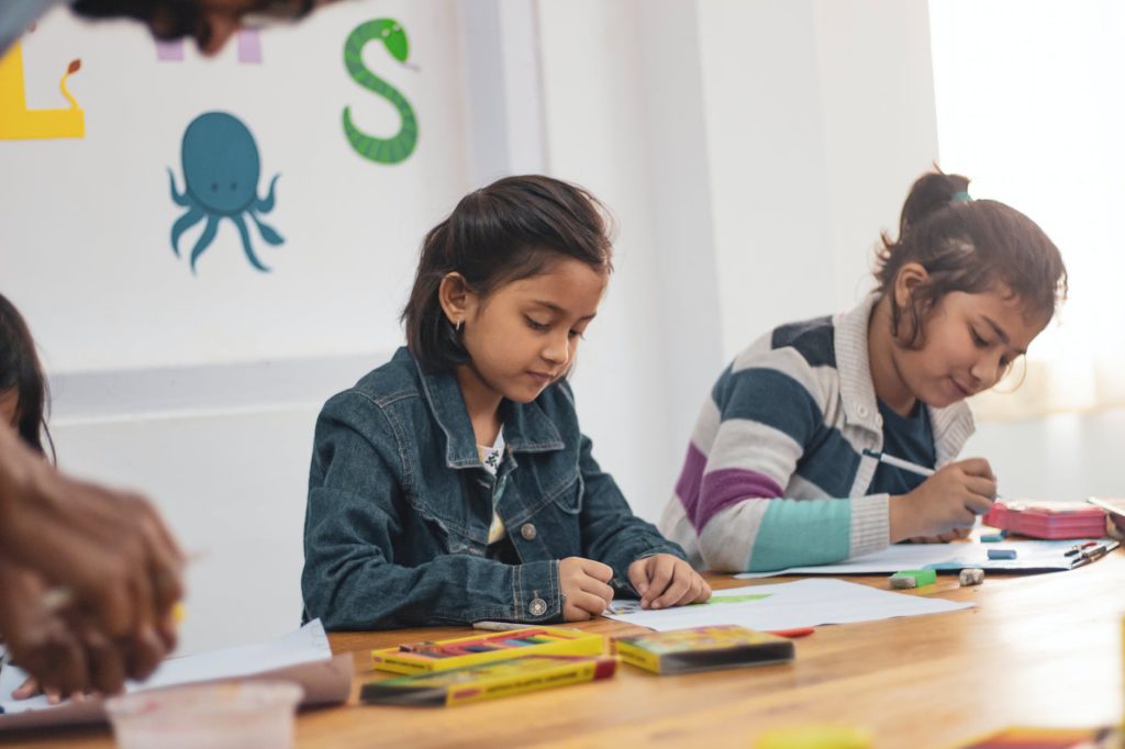 two girls doing school works