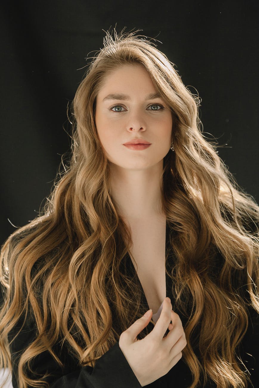 portrait of beautiful woman with long wavy blonde hair