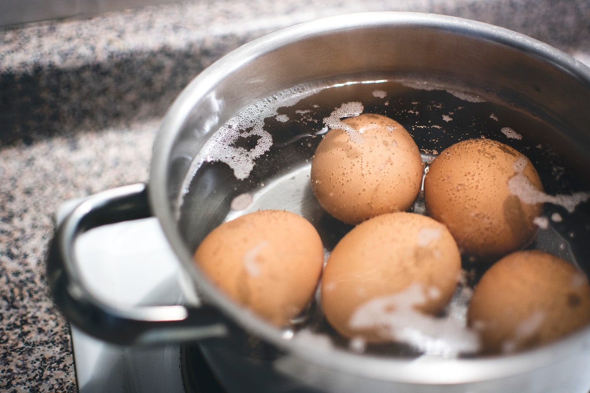 Eggs boiling in a pot