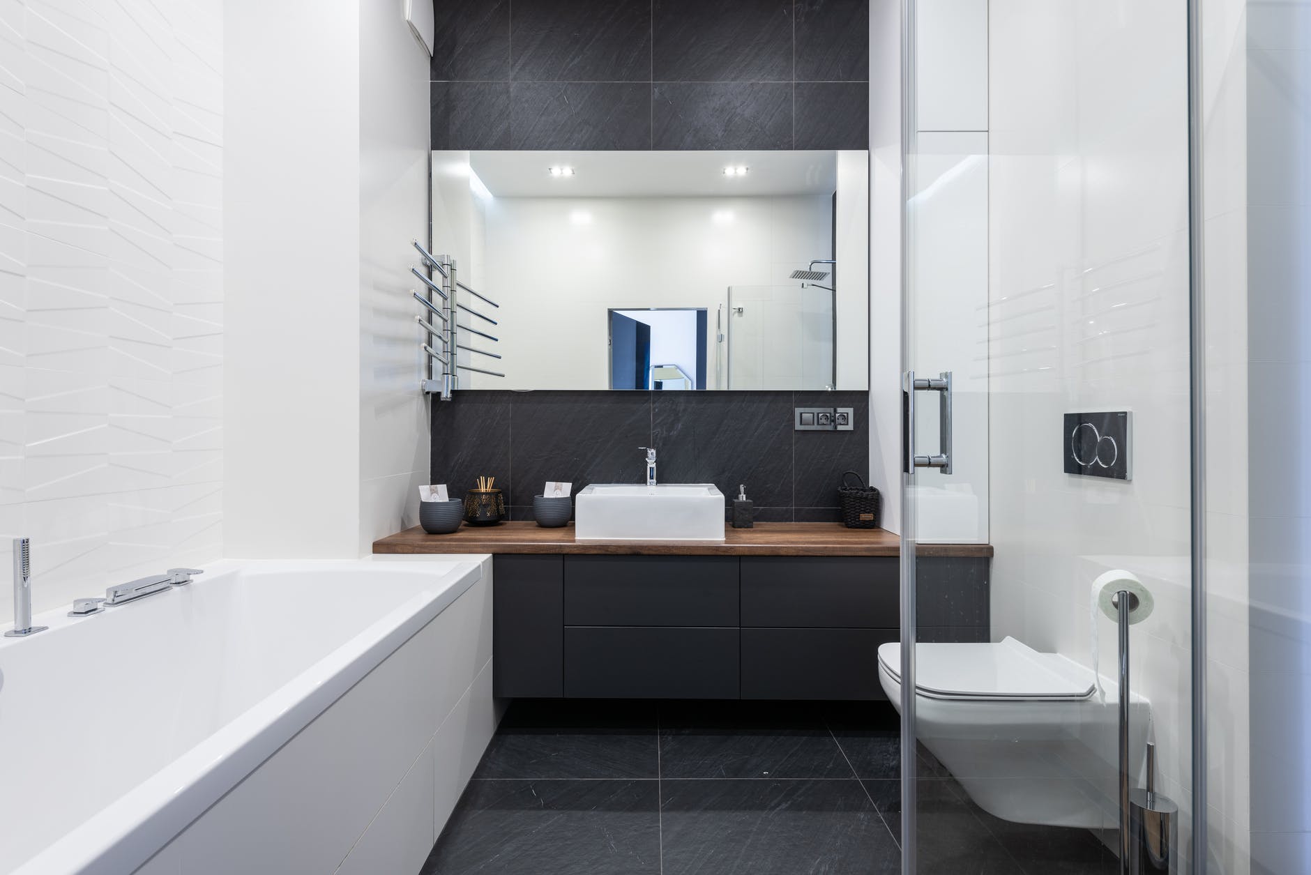 stylish bathroom with bathtub and shower cabin