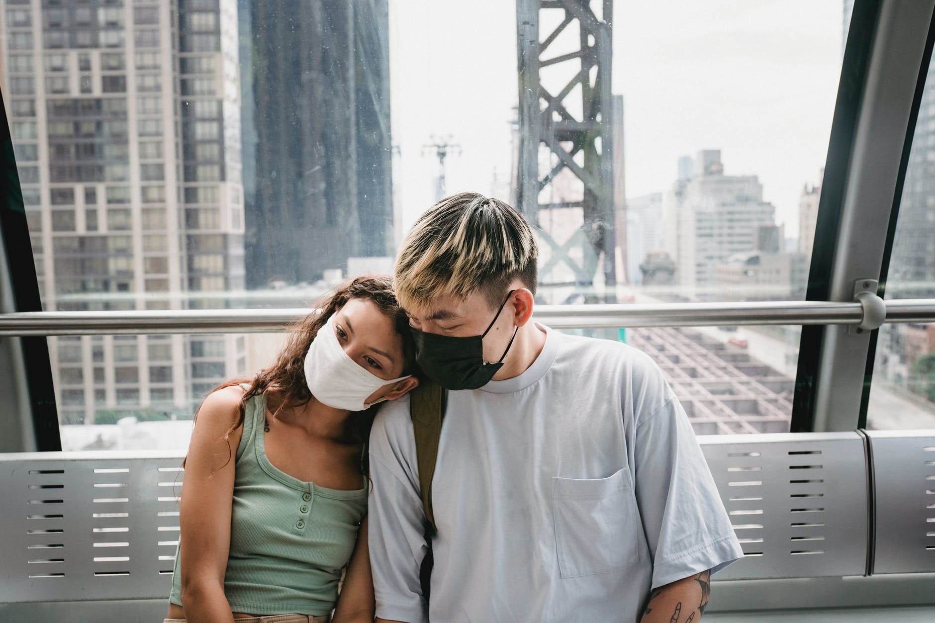 a couple wearing a face mask