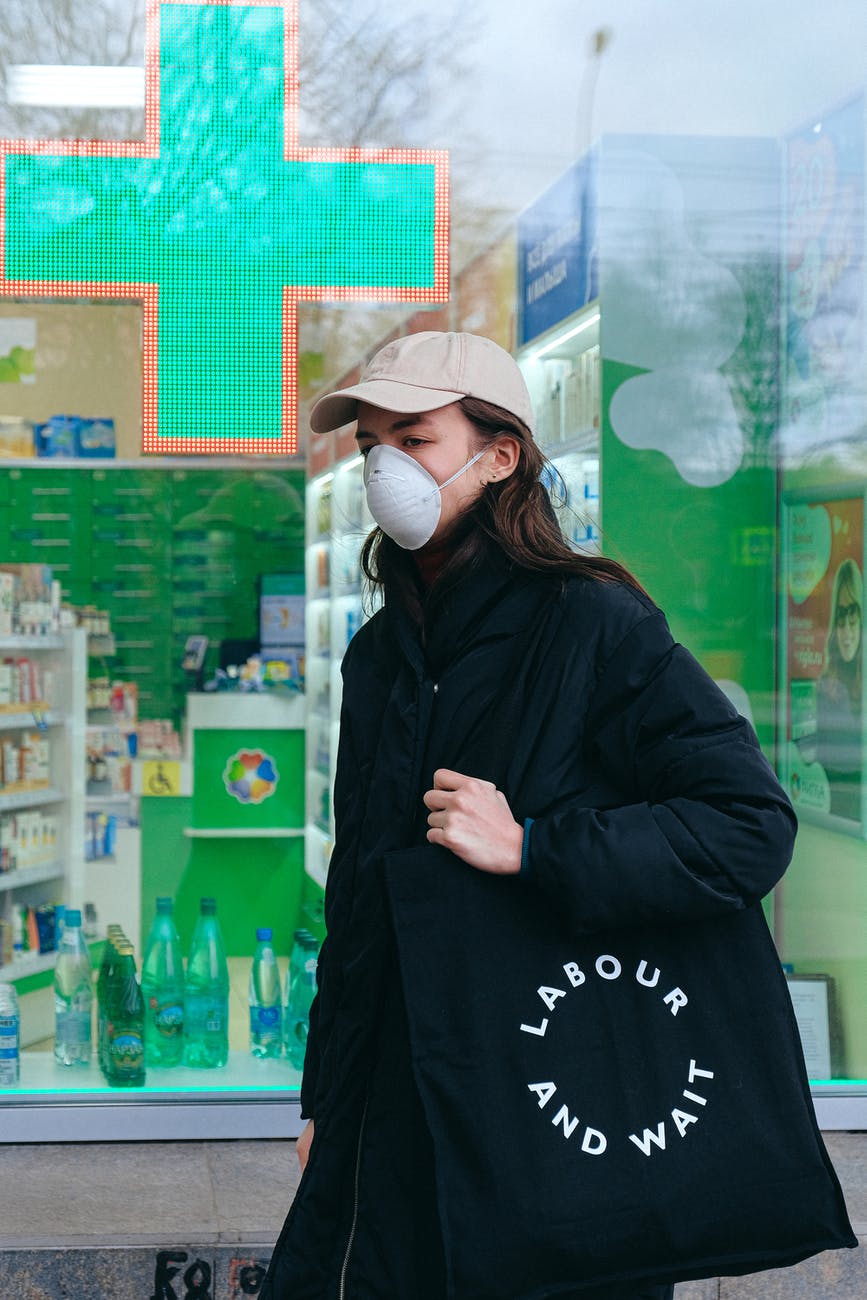 woman wearing face mask at pharmacy
