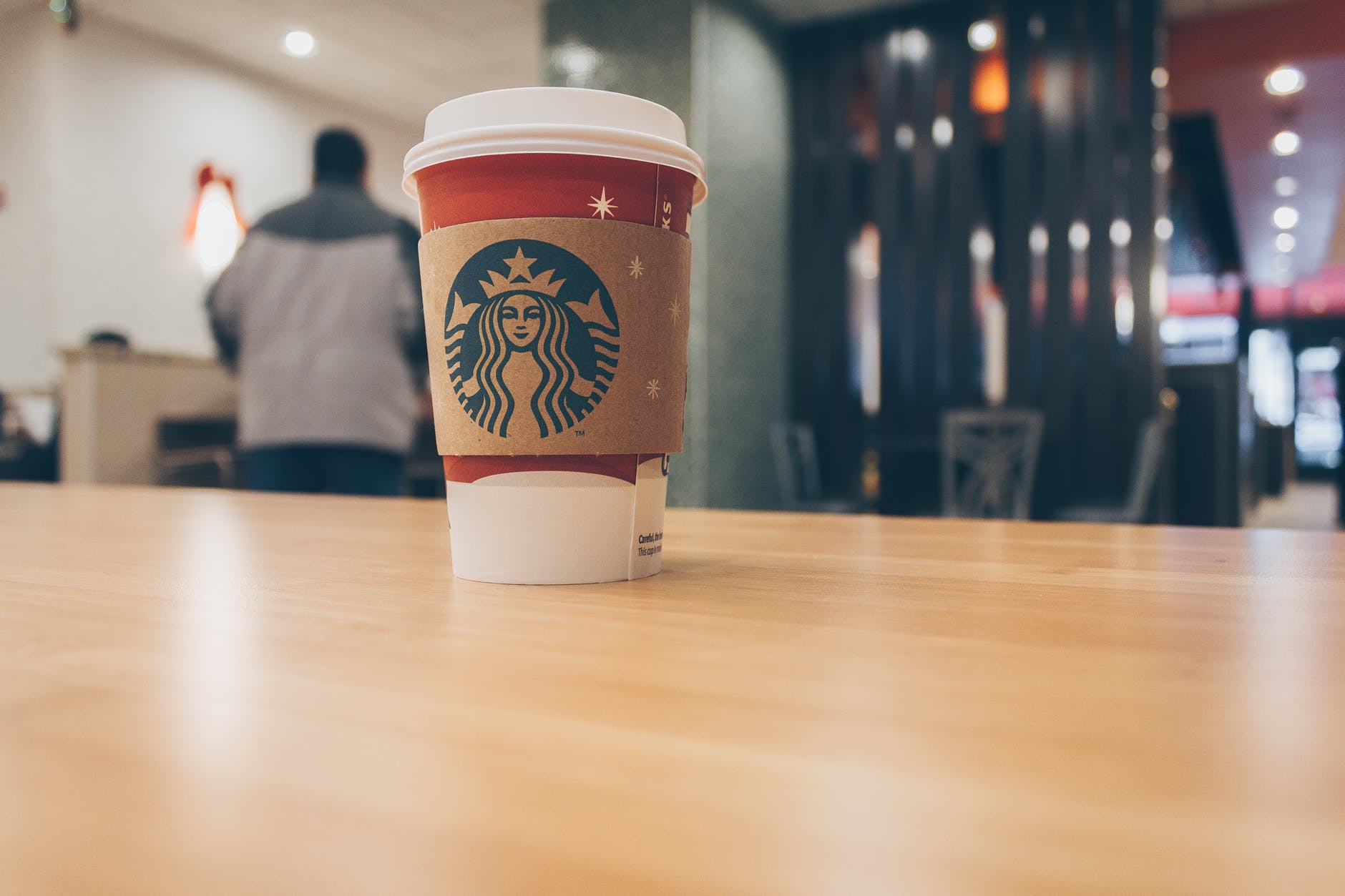 photo of paper cup on top of the table