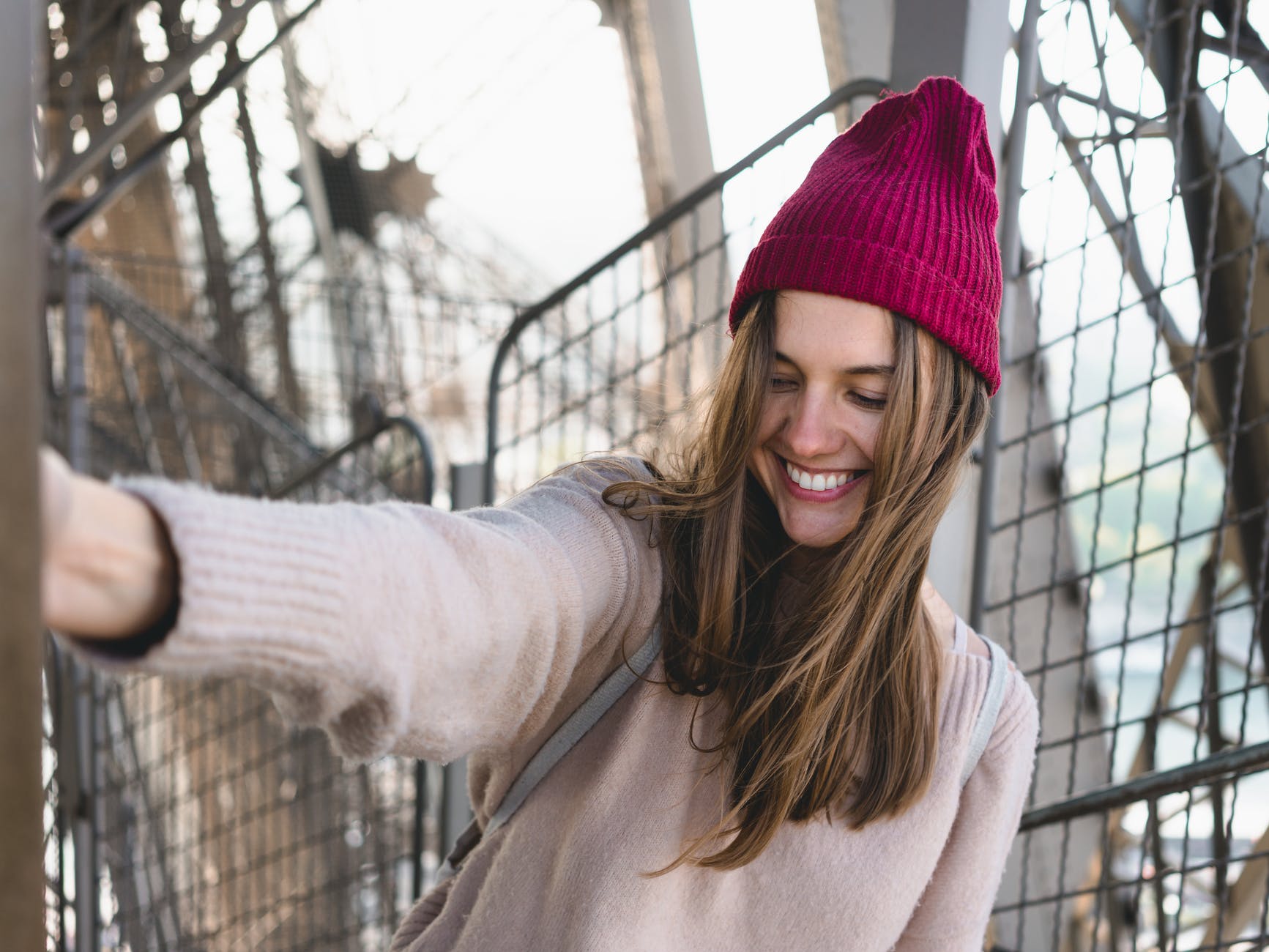 photo of woman wearing maroon beanie