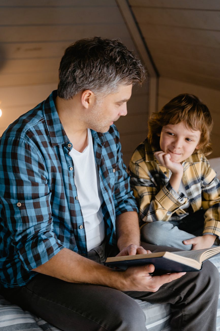 a father and son in plaid long sleeves