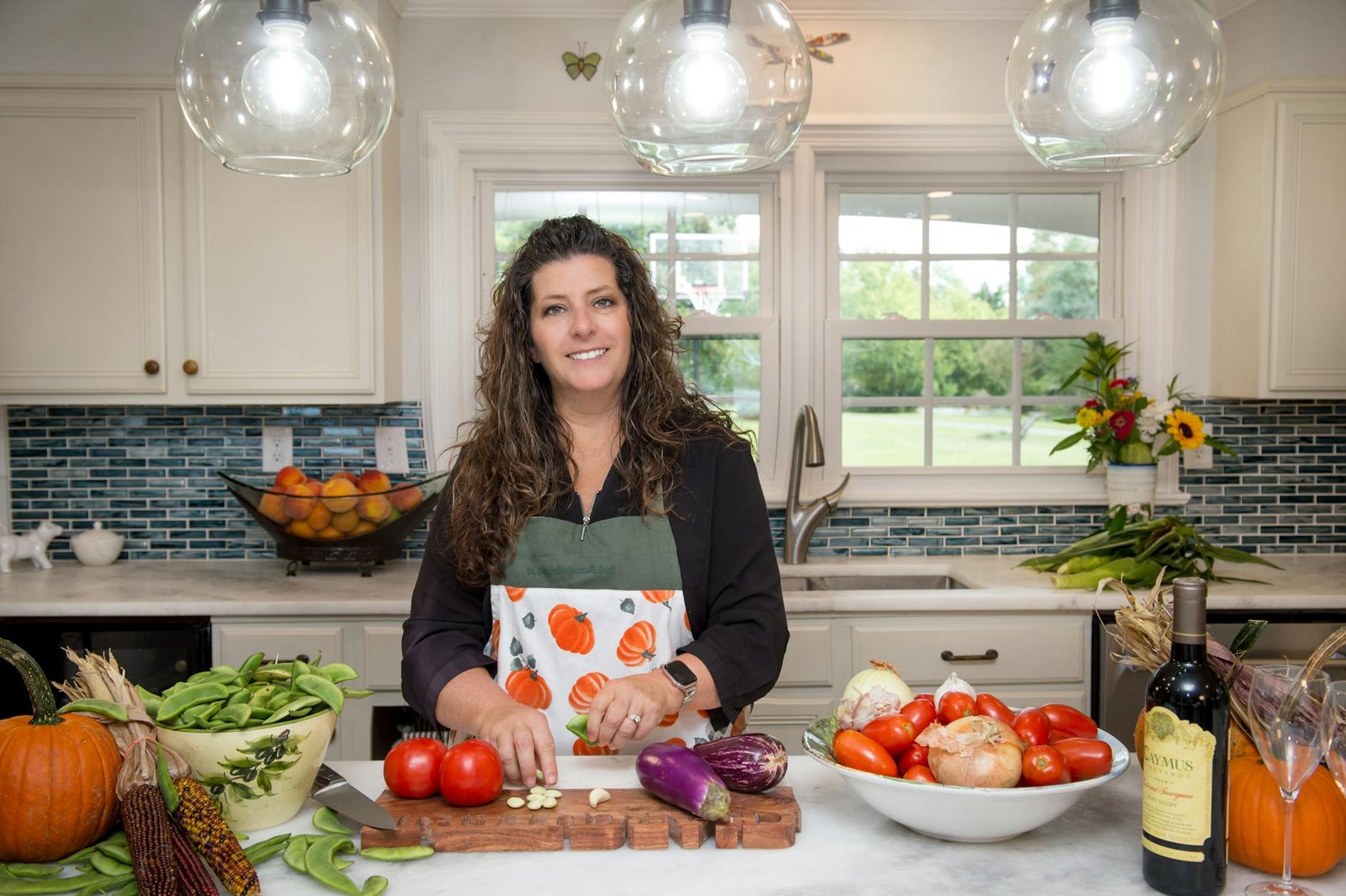 woman preparing fresh vegetables in a modern kitchen